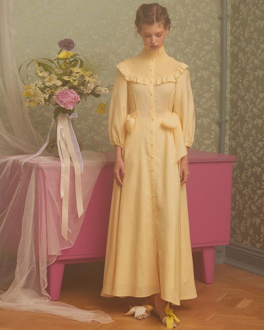 Soft yellow midi dress with bows